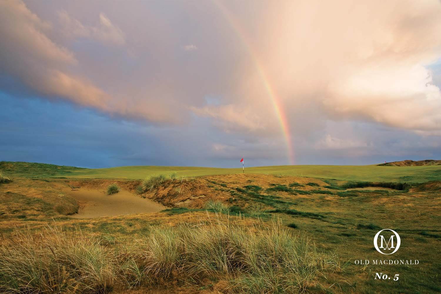 Landscape image of the 5th hole and distant rainbow on the Old Macdonald Golf Course, Bandon Dunes Golf Resort, Oregon, USA