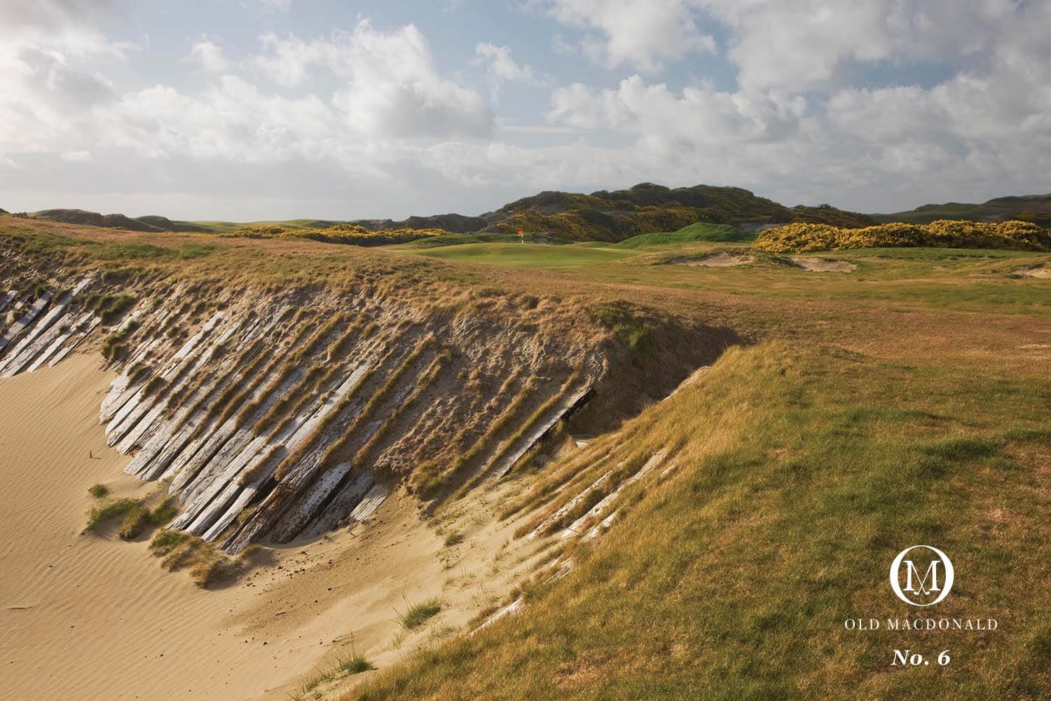 Image of a retaining wall and 6th green, Old Macdonald Golf Course, Bandon Dunes Golf Resort, Oregon, USA