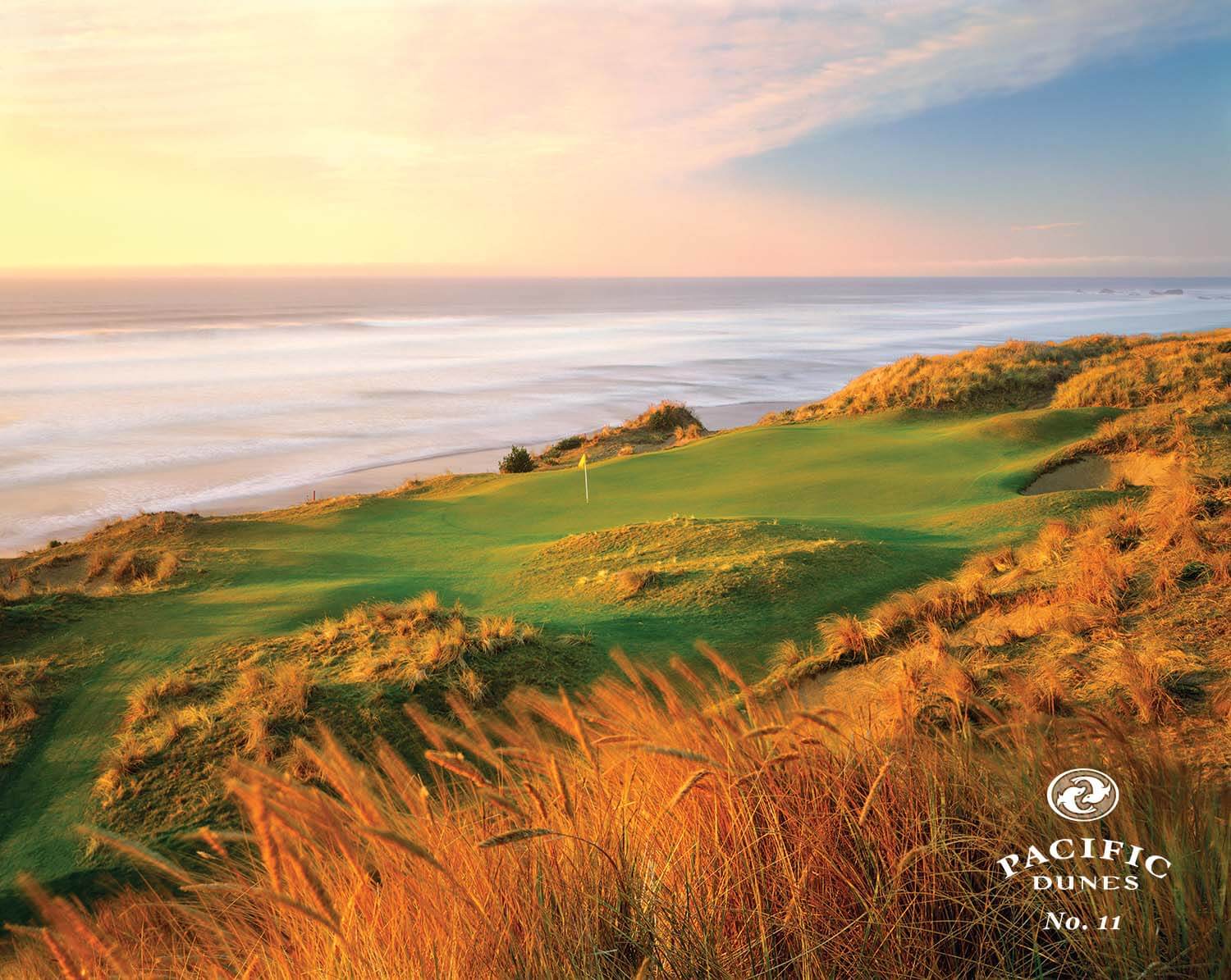 Image of the sun setting on the 11th hole, Pacific Dunes Golf Course, Bandon Dunes Golf Resort, Oregon, USA