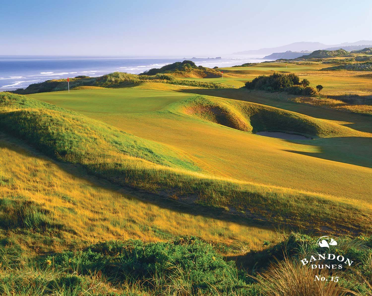 Image of the 15th fairway and strategically placed bunker on the Bandon Dunes Golf Course, Bandon, Oregon, USA