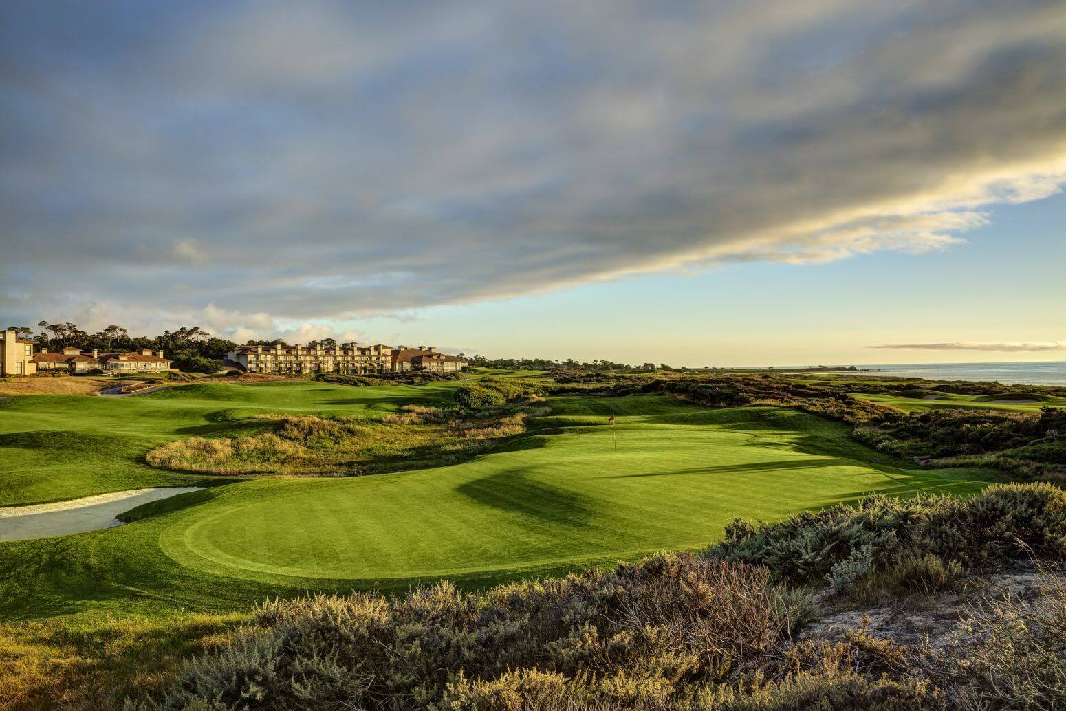 Image of long shadows on the green of the golf course, The Links at Spanish Bay, Pebble Beach, California, USA