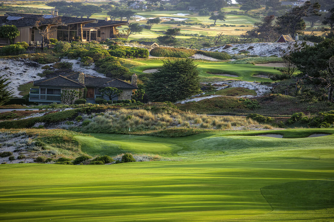 Depicting a house and green at Pebble Beach Spyglass Hill Golf Course
