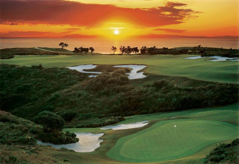Image of the setting sun over the north course, Pelican Hill Resort, Newport, California, USA