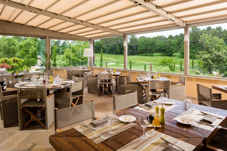 Displaying the course-side clubhouse restaurant at Terre Blanche, Tourrettes, French Riviera