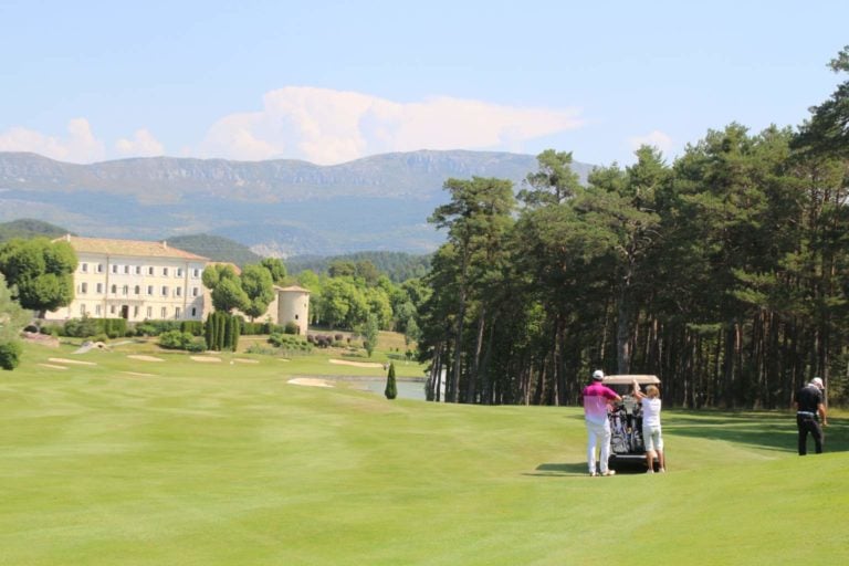 An image of golfers playing the 18th hole at Chateau de Taulane, France.