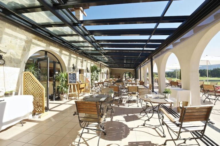Image of outdoor patio dining area, Chateau de Taulane, France.