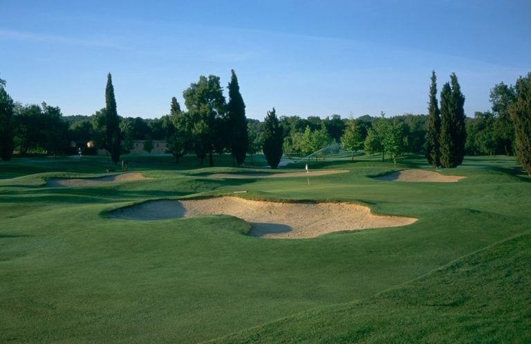 A green is surrounded by bunkers on the Opio Valbonne Course, Chateau De La Bégude , French Riviera, France