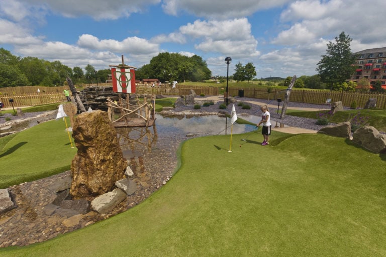 Displaying children on the putting game, The Celtic Manor Resort, Usk Valley, Wales, United Kingdom