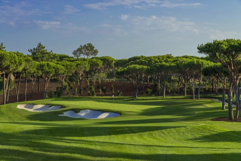 View of a green and trees on The North Course, Quinta do Lago, Algarve, Portugal