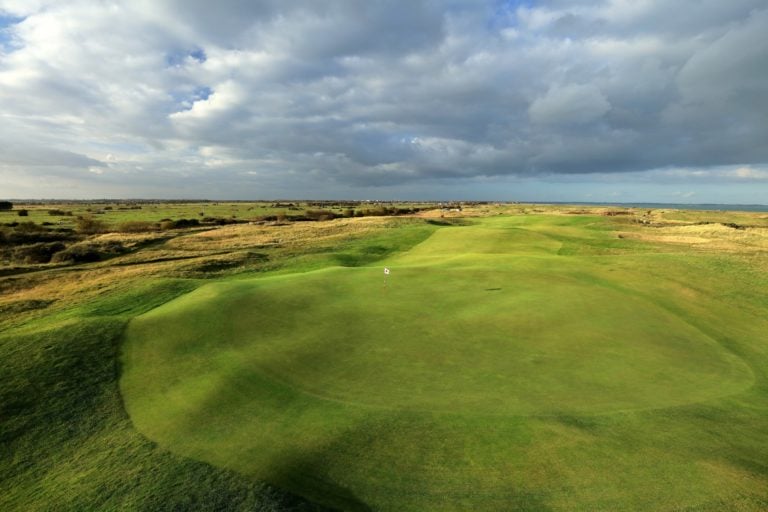 Image of the par-4 17th hole green on the golf course at Royal Cinque Ports Golf Club, Kent, England