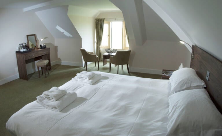 Image overlooking the Lodge King Bed and alcove window at Prince's in Sandwich, Kent, England, United Kingdom