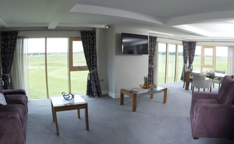 Image of a lounge and dining table in the Links Suite at Prince's in Sandwich, Kent, England, United Kingdom
