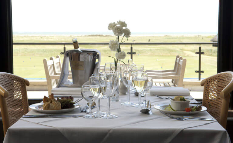 Image of a lunch setup on the balcony overlooking the golf course at Prince's in Sandwich, Kent, England, United Kingdom