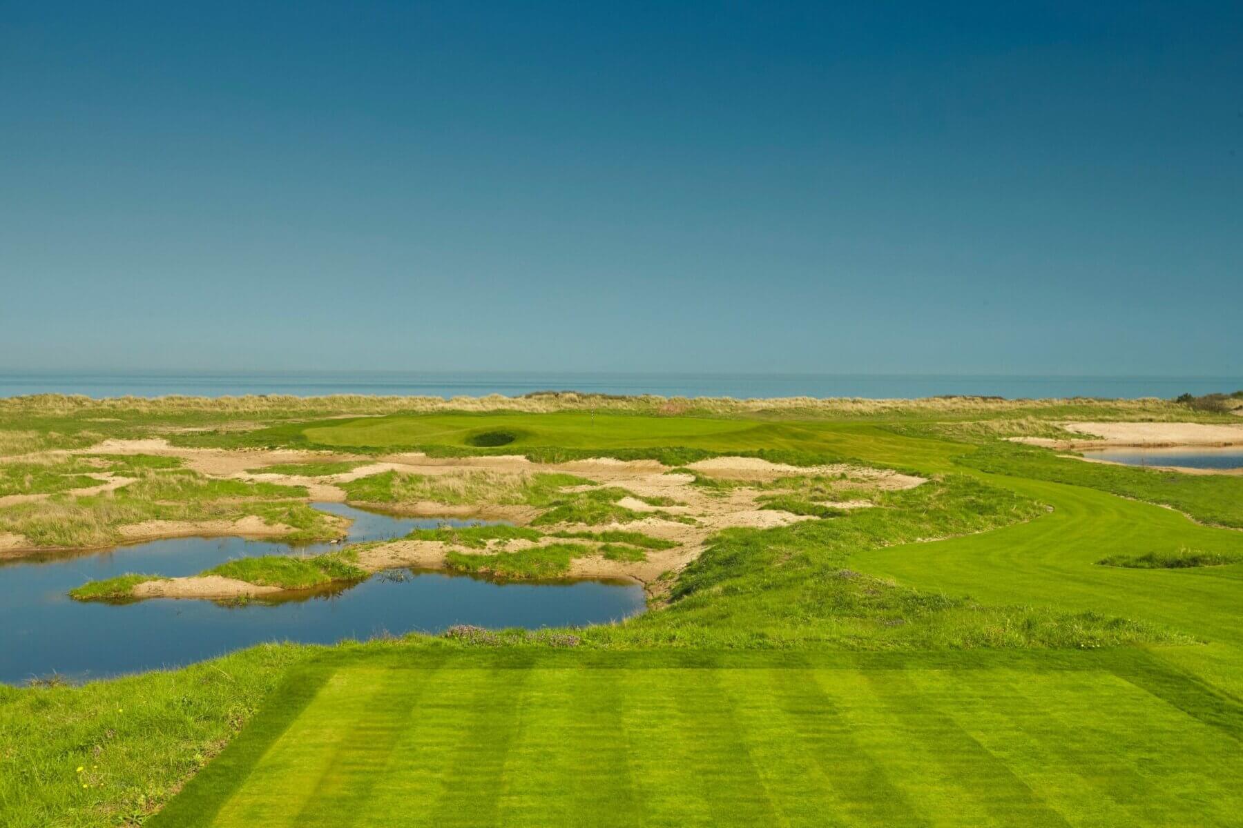 Image looking towards the green over the hazard on the Bloody Point 5th hole at Prince's in Sandwich, Kent, England, United Kingdom