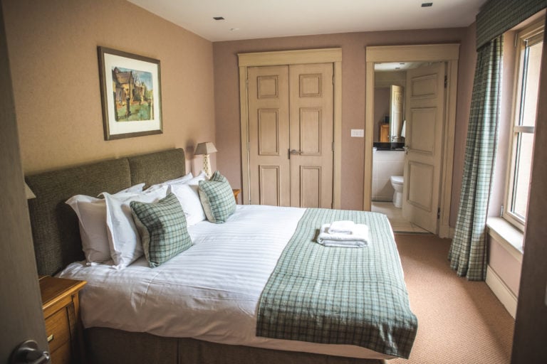 Image of a bedroom in the Golf Lodge at Castle Stuart Golf Links, Inverness, Scotland