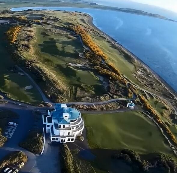 Aerial image of the clubhouse and first nine at Castle Stuart Golf Links, Inverness, Scotland