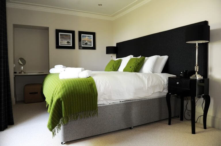 Image of a bedroom in the Farmhouse at Castle Stuart Golf Links, Inverness, Scotland
