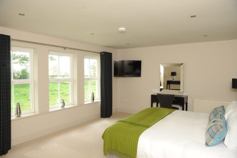 Image displaying the inside of an en-suite bedroom at Castle Stuart Golf Links, Inverness, Scotland