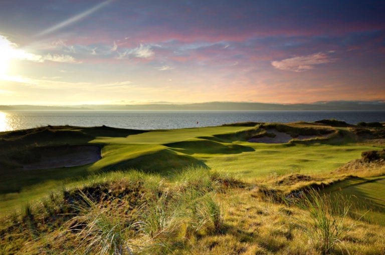 Image overlooking the 11th hole with a very colourful sky at Castle Stuart Golf Links, Inverness, Scotland