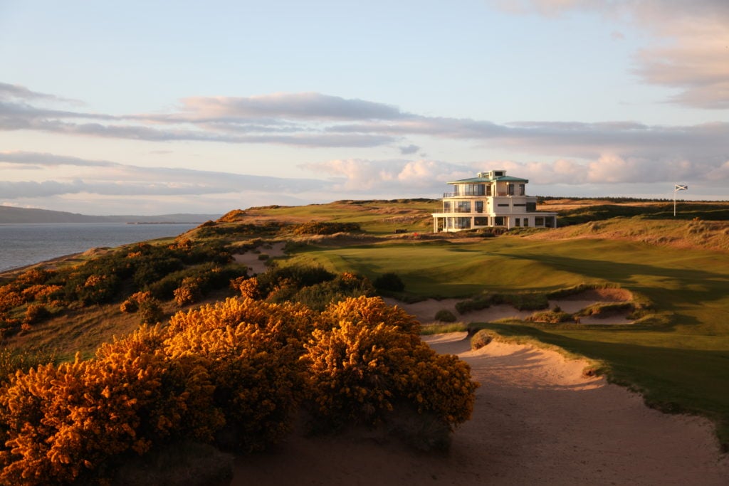 Image of the 9th green and clubhouse at the Castle Stuart Golf Links, Inverness, Scotland