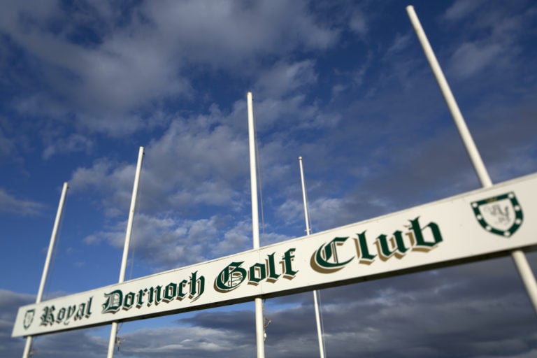 Image of the 1st tee flag pole of the Championship course at Royal Dornoch Golf Club, Scotland