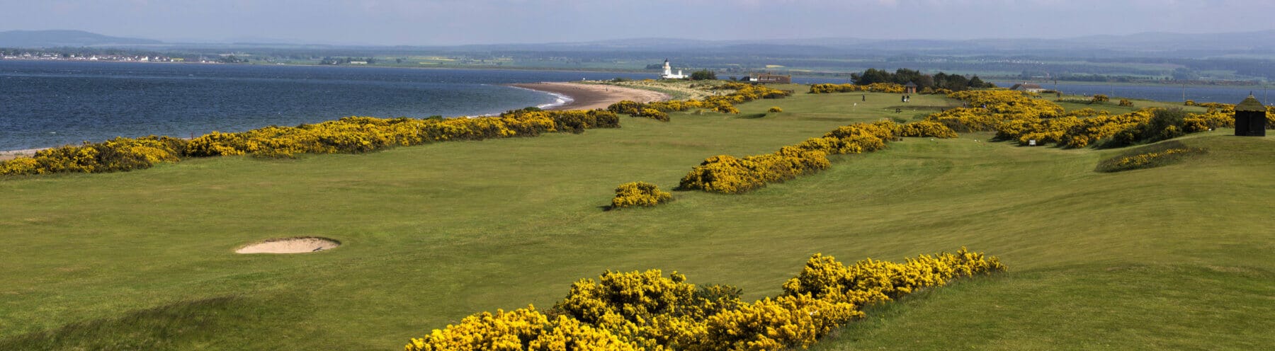 Image of the beach in the background and golf course in the foreground at Fortrose and Rosemarkie golf Links, Inverness, Scotland