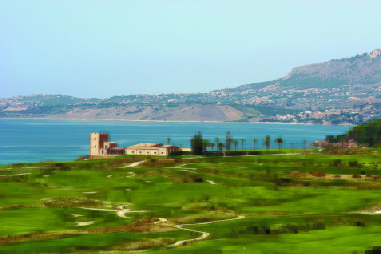 Image of the golf course, Sicilian buildings and Mediterranean Sea at Verdura Resort, Sicily, Italy