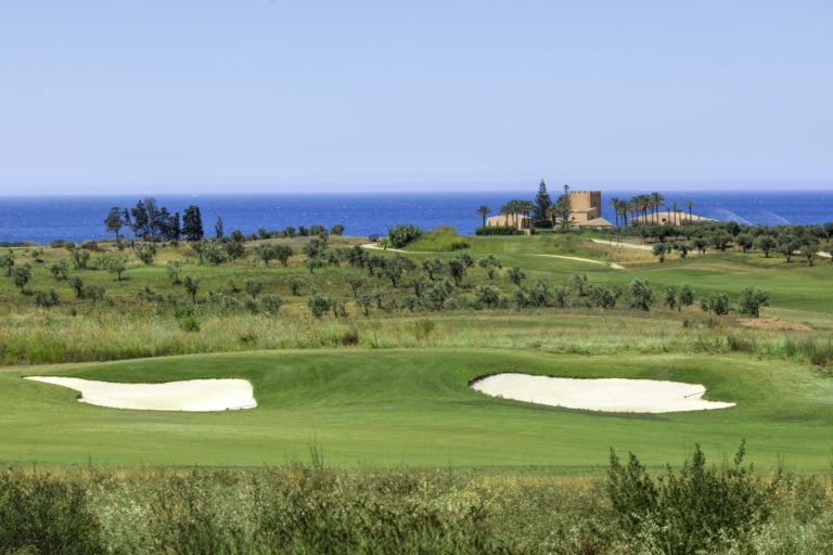 Image of the golf course and distant Mediterranean Sea at Verdura Resort, Sicily, Italy