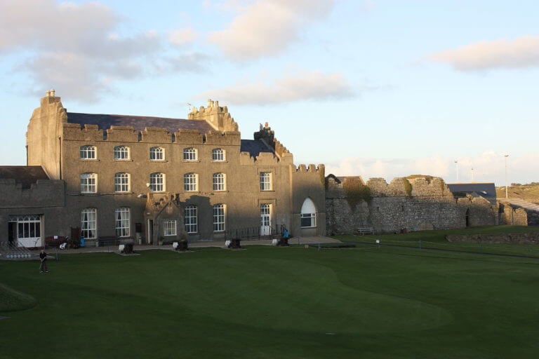 Image depicting the old clubhouse and practice putting green at Ardglass Golf Club, Northern Ireland