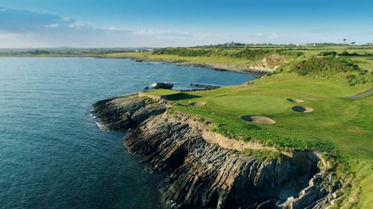 Aerial image of rock contrasting with the green of the golf course at Ardglass Golf Club, Northern Ireland