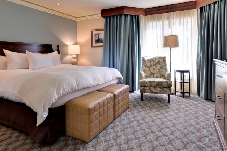 Image depicting a king bed inside a Resort Condo at Kingsmill Resort, Williamsburg Virginia, USA
