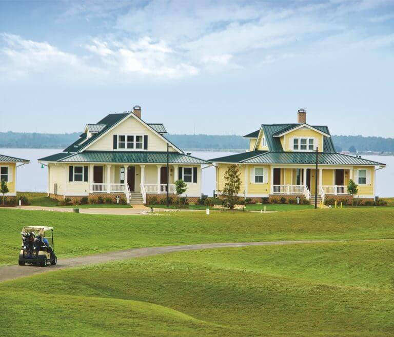 Image depicting golf carts in front of two cottages by the James River at Kingsmill Resort, Williamsburg Virginia, USA