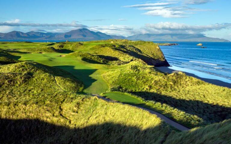 Aerial image of the second hole snaking between dunes at Tralee Golf Club, County Kerry, Ireland