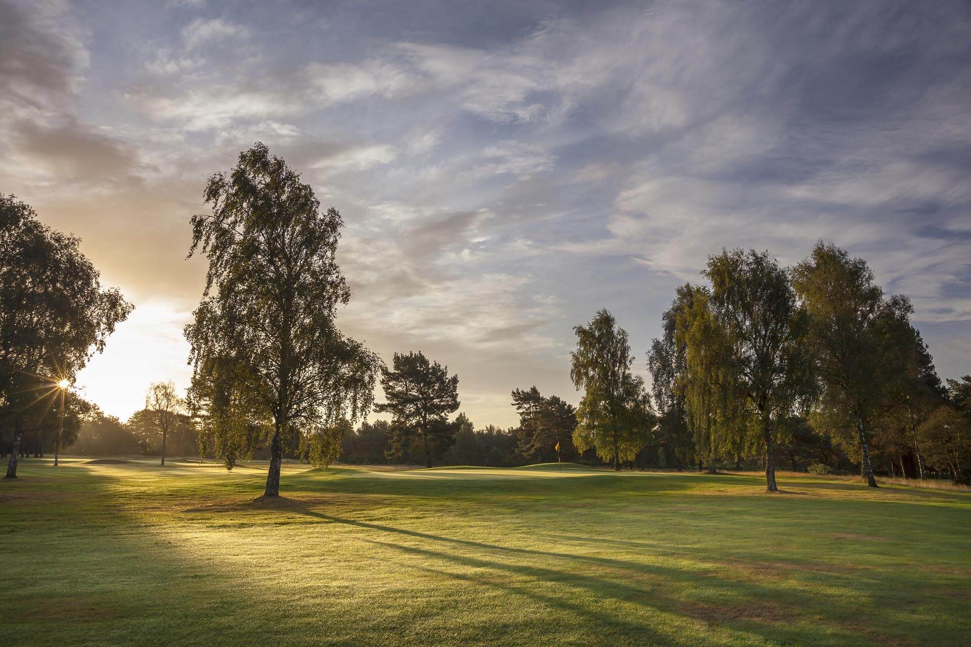 Image of the rising sun over Ladybank Golf Club, Fife, Scotland