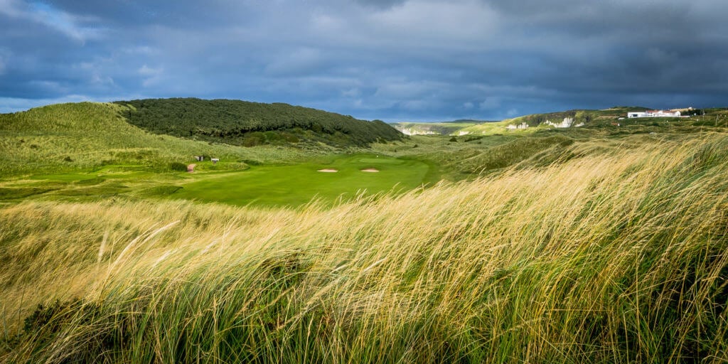 View of a green and long grass at Valley Golf Course at Portrush