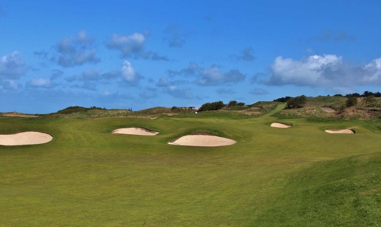 Image depicting the 2nd green and surrounding pot bunkers at Royal Portrush Dunluce Golf Course, Portrush, County Antrim, Northern Ireland