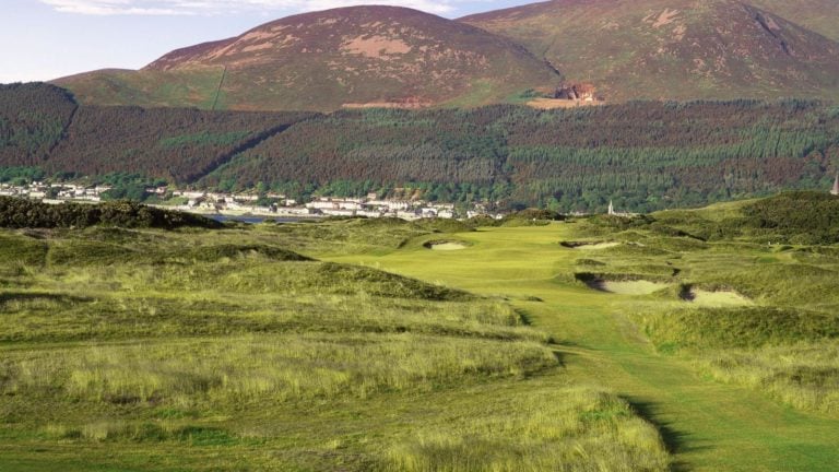 Image displaying the Golf Course and town of Newcastle behind Royal County Down Golf Club, Northern Ireland
