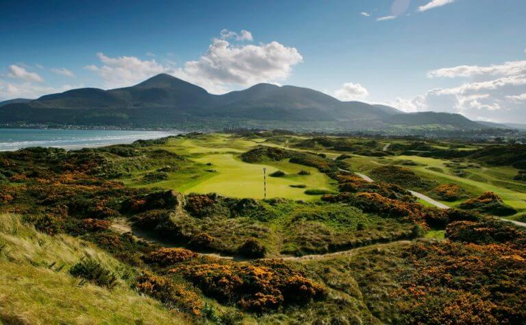 Image overlooking the 2nd hole and distant mountains at Royal County Down Golf Club, Northern Ireland