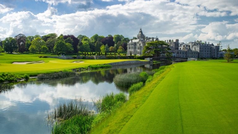 Image depicting the river running next to the 18th green and resort building at Adare Manor, County Limerick, Ireland, Europe