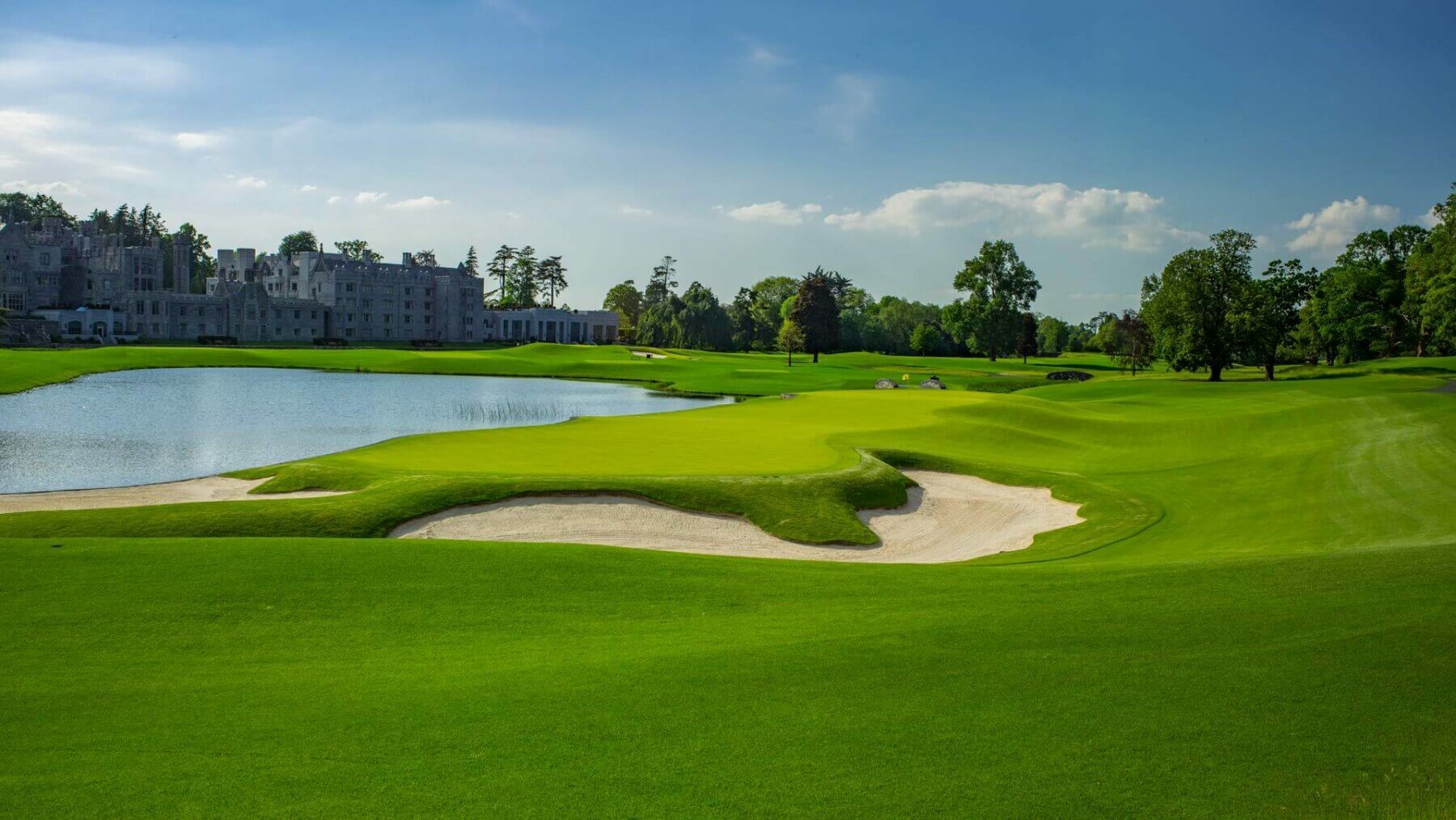 Image of the 16th hole green looking back towards the main resort building at Adare Manor, County Limerick, Ireland, Europe