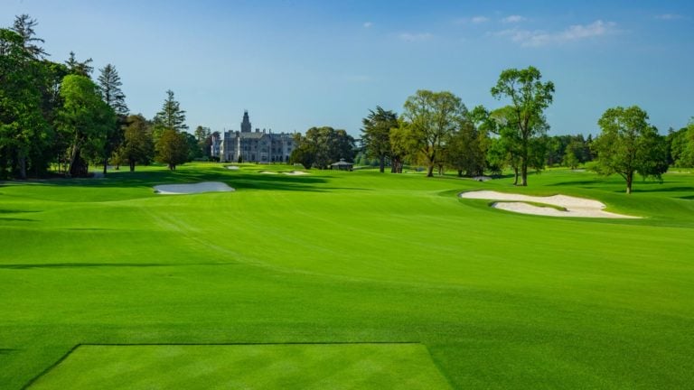 Image depicting the 9th hole and distant manor building at Adare Manor, County Limerick, Ireland, Europe