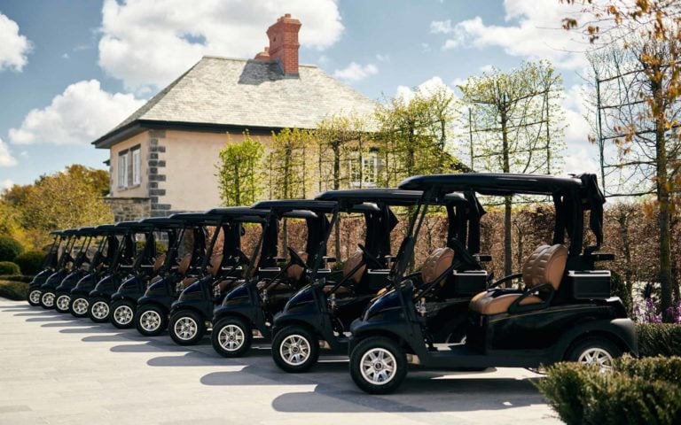 Image displaying golf carts in a row at Adare Manor, County Limerick, Ireland, Europe