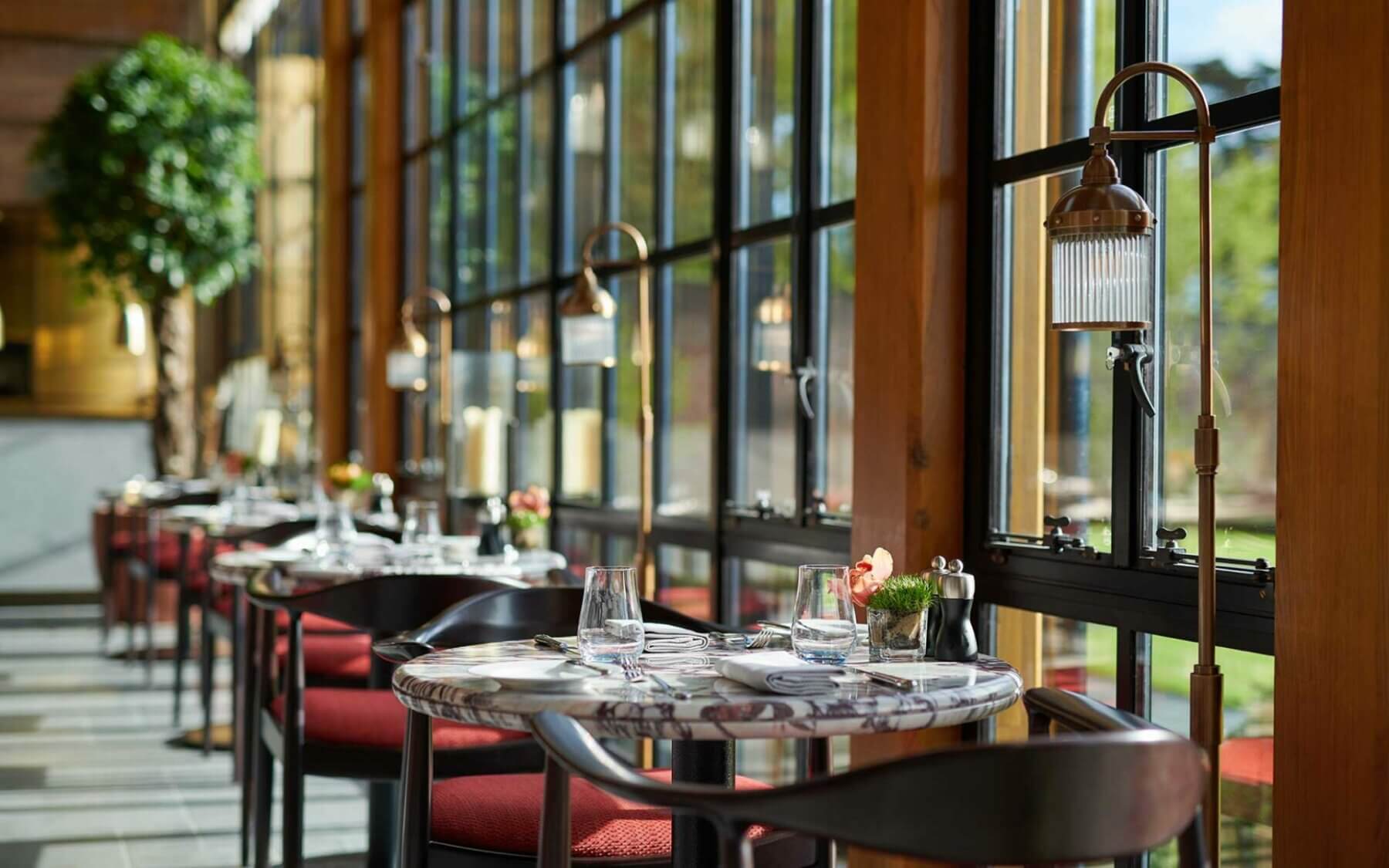 Closeup image of windowpanes and luxury table settings at Adare Manor, County Limerick, Ireland, Europe