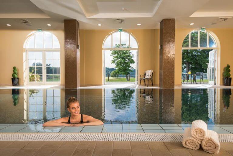 Image of a woman in the infinity pool at Lough Erne Resort, Fermanagh Count,Northern Ireland, United Kingdom