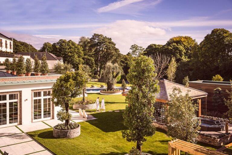Image of the thermal spa village surrounded by lush green bush, Galgorm Resort, County Antrim, Northern Ireland