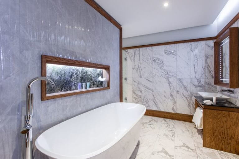 Image depicting a marble bathroom and free-standing bath in a deluxe room, Galgorm Resort, County Antrim, Northern Ireland