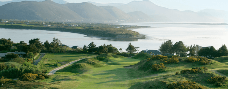 Aerial image of the Golf Course and surrounding village around Dooks Golf Club, County Kerry, Ireland