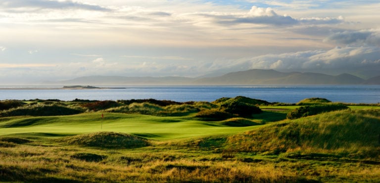 Panorama view of a fairway, ocean and mountains at Dooks Golf Club, County Kerry, Ireland