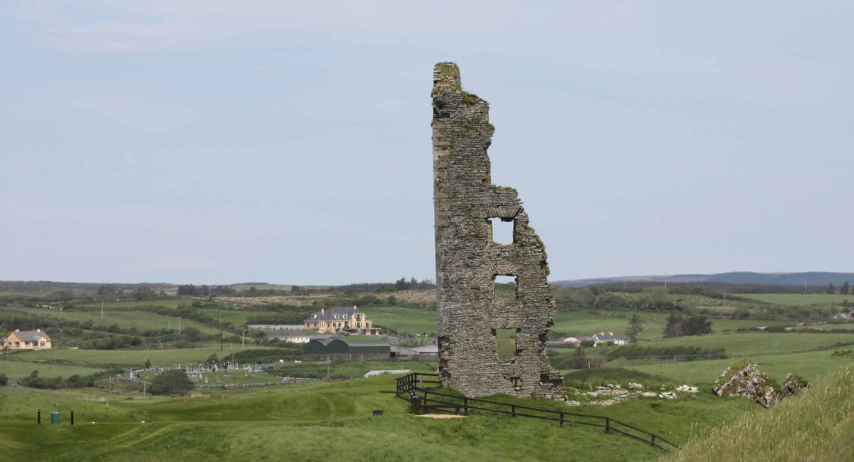 Image displaying the tall ruins of an old castle at Castle Golf Course at Lahinch Golf Club, County Clare, Ireland