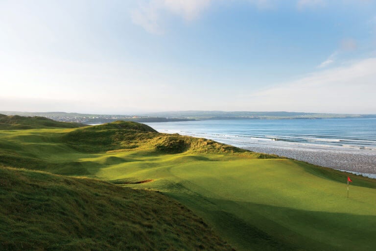 Image overlooking the 7th hole and distant sea on the Old golf course at Lahinch Golf Club, County Clare, Ireland